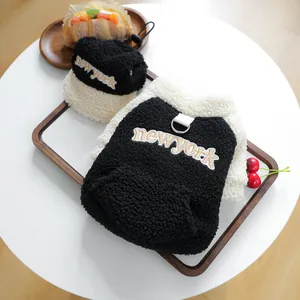 Close-up of cozy lamb velvet dog vest and hat set with New York embroidery details