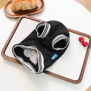Detail of pet striped jersey with woven PETCIRCLE brand label and ribbed cuffs