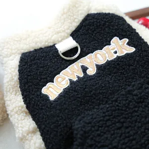Detail of sherpa fleece pet vest with newyork embroidery and metal D-ring attachment