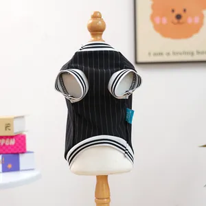 Detail of striped pet jersey showing ribbed edges and a blue brand label on soft fabric