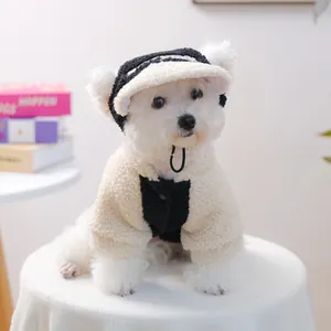 Close-up of cozy lamb wool pet vest and matching hat on a small dog with soft texture details