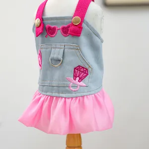Detailed view of pink sequin heart embroidery and chiffon tutu on blue denim pet dress