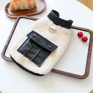 Warm fleece dog vest with black leather pocket and D-ring on beige sheepskin fabric