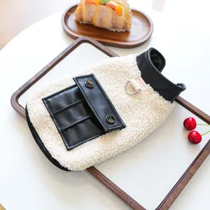 Close-up of cozy lamb wool pet vest with leather pocket and metal D-ring for leash attachment