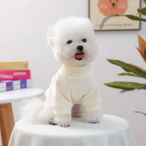 Close-up of cream-colored ribbed pet sweater featuring textured knit and high neck