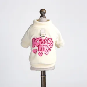 Knitted pet sweater in off-white with pink Kiss Me embroidery and back D-ring