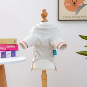 Close-up of the cherry pet vest showing red stitching detail and brand label on a mini model