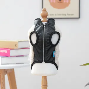 Detail of pet vest with black leather back, zipper closure and soft faux lamb wool lining
