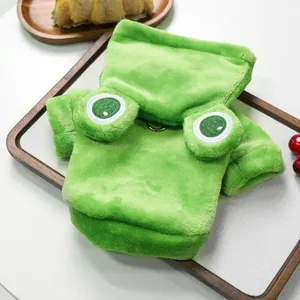 Detail of green plush frog pet costume showing soft fur texture and metal D-ring for leash