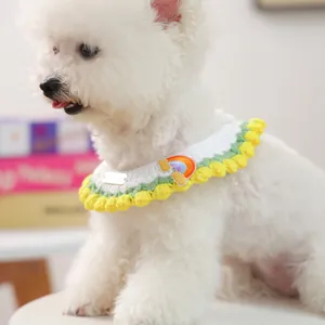 Handmade knitted pet collar with rainbow patch and yellow pom-poms for cats and small dogs