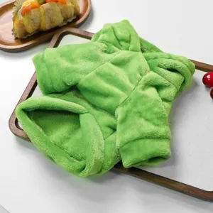 Detail of green flannel pet sweater with soft plush texture for cats and small dogs