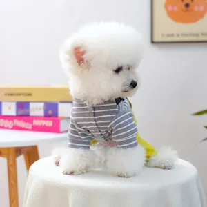 Cute striped pet overalls with buttons for small dogs and cats in a home setting