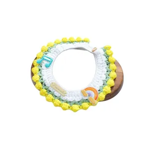 Handmade crochet pet scarf with colorful music note embroidery and pom pom trim