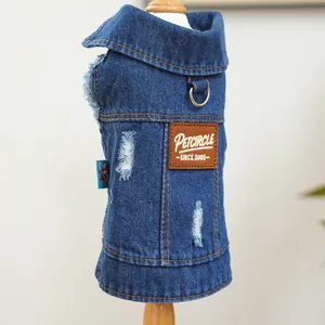 Detail of dark blue denim pet vest featuring yellow contrast stitching and metal D-ring