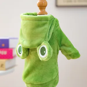 Detail of soft green flannel pet hoodie featuring frog eyes and plush texture