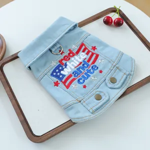 Close-up of pet denim vest with red white and cute embroidery and metal D-ring detail