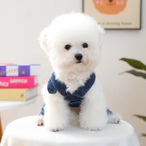 Detailed view of the adjustable metal buckles and denim texture on dog overalls
