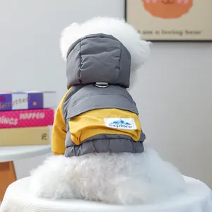 Detail of warm dog winter jacket featuring a back pocket with D-ring for leash attachment