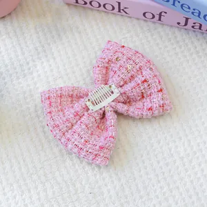 Barrette à cheveux pour animaux en tweed rose et blanc avec paillettes dorées