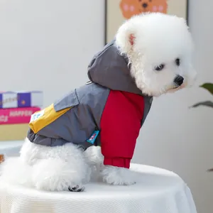 Detail of color-block hooded pet jacket with windproof fabric for small dogs