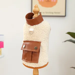 Detail of warm lamb wool pet vest with brown leather pocket and metal D-ring attachment