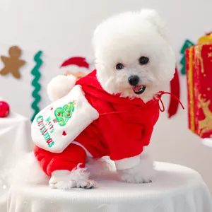 Detailed close-up of a red fleece dog hoodie with white trim and Merry Christmas embroidery