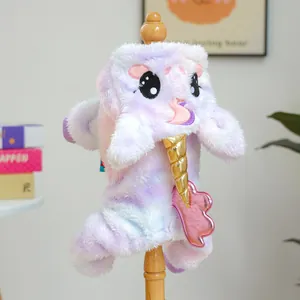 Detail of soft unicorn pet costume with golden horn and metallic wings on wooden mannequin