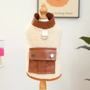 Fleece pet vest with brown faux leather pockets and D-ring for leash attachment