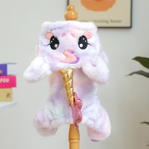Detail of plush rainbow unicorn dog hoodie with soft faux fur and golden spiral horn
