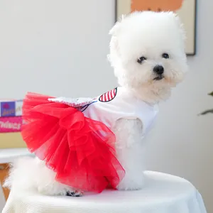 Close-up of pet tutu dress with sequin heart embroidery and red layered mesh skirt
