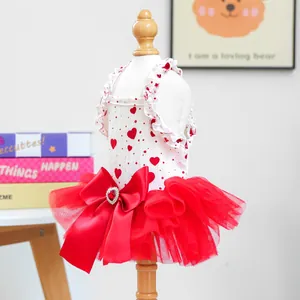 Detail of pet princess dress featuring red heart patterns and fluffy mesh tulle skirt