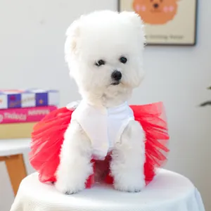 Detail of pet dress with white buttoned top, red tulle skirt, and silver sequin bow on back