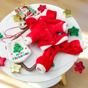 Detail of plush Christmas pet costume set with soft red fleece and a white festive bag