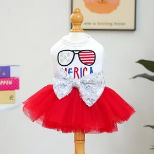 Detail of sequin bow and America embroidery on a patriotic tulle pet dress for dogs