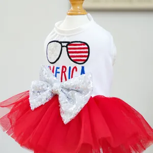 Close-up of patriotic pet dress featuring a sequin bow and tiered red mesh skirt