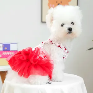 Detail of red tiered mesh tutu and floral pattern on a Valentine dog dress for small pets