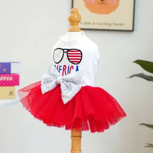Detail of dog dress with America star embroidery, sequin bow, and red tutu skirt