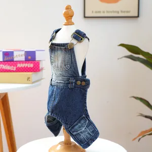 Detail of dog denim overalls featuring adjustable metal buckles and small functional pockets