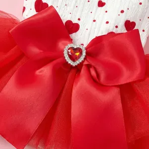 Dog Valentines dress with red heart patterns, satin bow and heart ruby detail