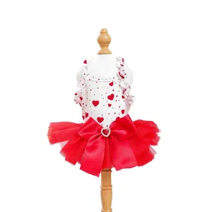 White pet princess dress with red hearts and layered tulle tutu on a wooden model stand