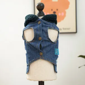 Close-up of pet denim vest with green lamb wool collar and bronze snap buttons