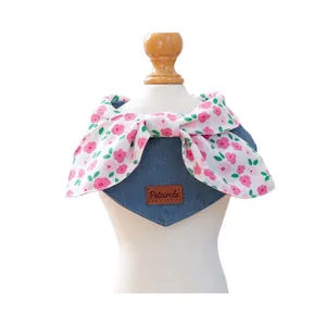 Floral bow denim pet bandana bib for cats and dogs on white mannequin display