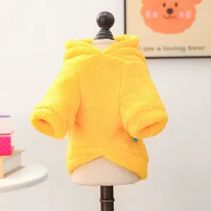 Close-up of plush yellow pet hoodie on mannequin showing soft fleece texture and warm hood