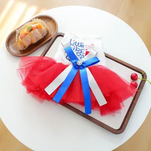 Close-up of red and white pet tutu dress with Little Fire Cracker embroidery and bow
