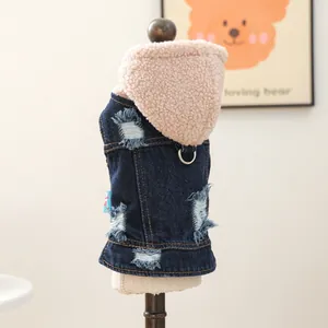 Close-up of denim pet vest with lamb wool hood and D-ring for leash attachment
