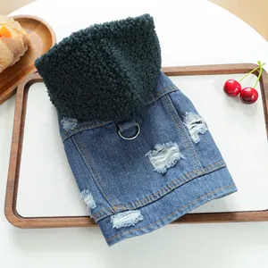 Detail of distressed denim pet vest with black fleece hood and metal D-ring for leash
