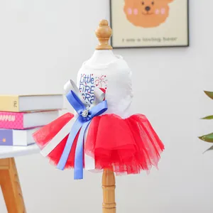 Detail of pet dress featuring star embroidery and layered tulle skirt with bow