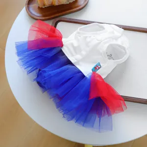 Detail of pet princess tutu dress with white cotton top and red-blue mesh skirt