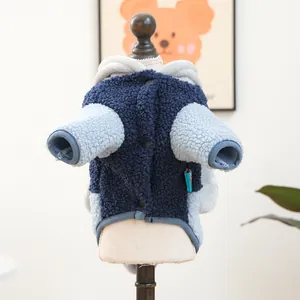 Detail of grey-blue fleece dog hoodie with snap buttons and warm lamb wool texture