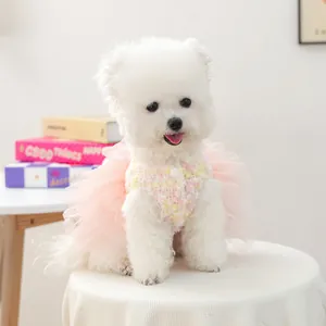 Cute pink tweed tulle dog dress detail view, fluffy mesh pet skirt for small puppies.